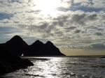 FZ010228 Three Cliffs Bay hole in rocks and river over beach.jpg